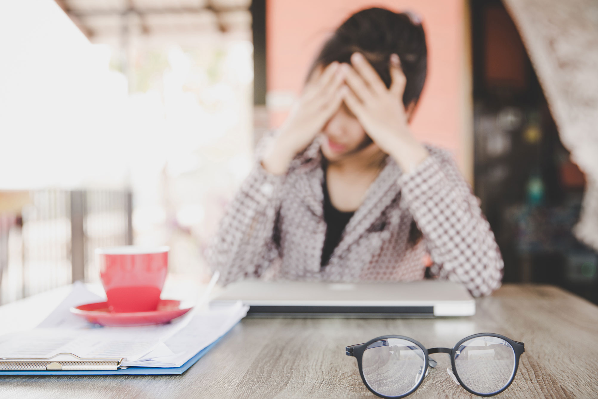 Stressed out woman blurred in background