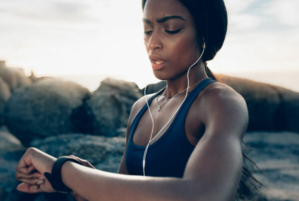 Workout woman checking smartwatch